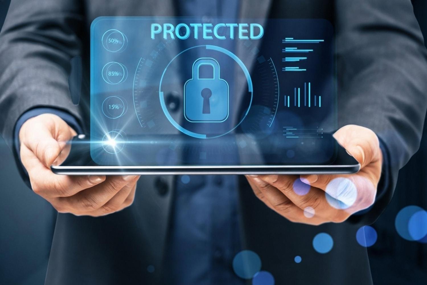 Businessman holding a tablet showing a protected data security dashboard